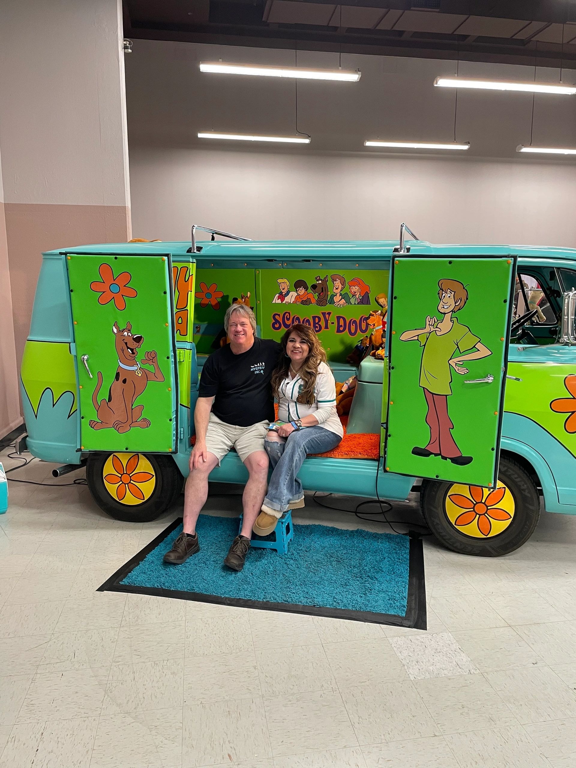 Fans posing inside the Mystery Machine